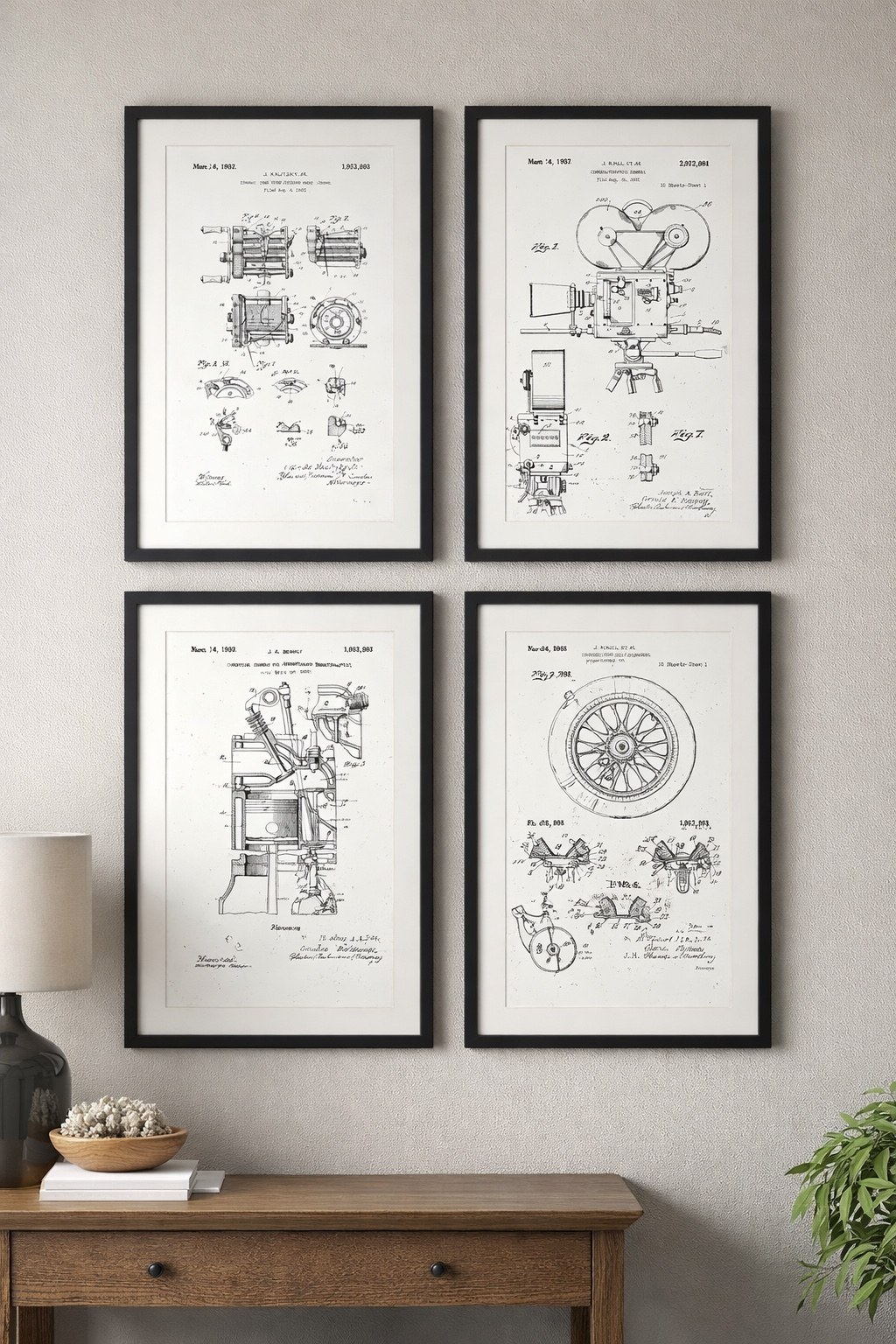Four framed vintage patent drawings displayed on a wall above a wooden console table